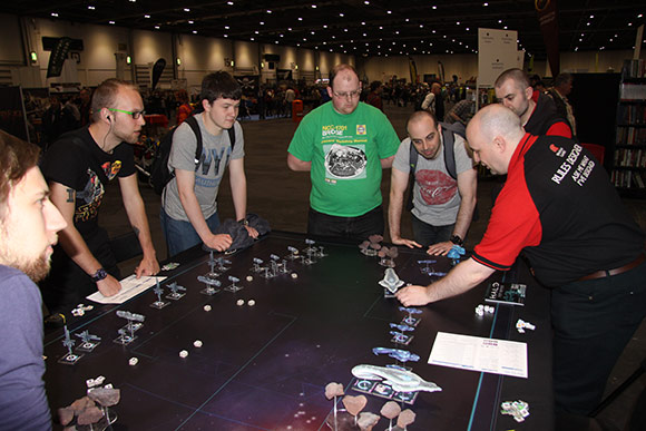 Spartan Derek leading a group of Salute attendees through a game of Halo: Fleet Battles