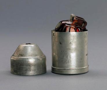 The Holman Projector Grenade and container